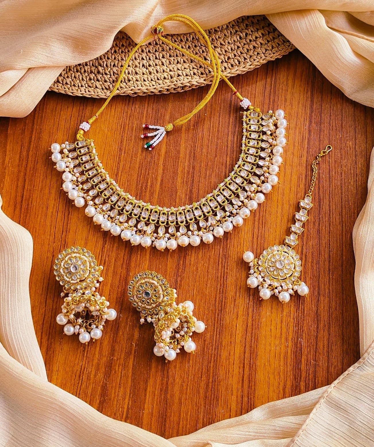 Kundan necklace set with teeka